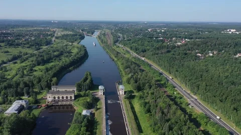 Smooth sideway drone flight over canal with camera rotation Stock Footage 321643494