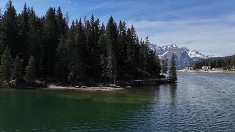 Smooth Skimming Water Level Push Shot Revealing Snow Capped Dolomites Wa Stock Footage 340448825