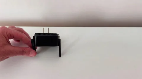 Smooth Slide: Internet Amplifier Glides Across Clean White Surface Video stock 319981136