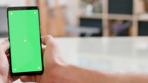 Smooth slide motion with a green screen on a smartphone display Stock Footage 105701129