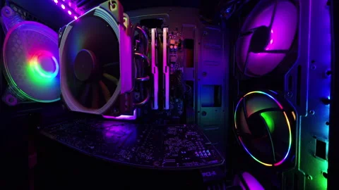 A smooth slider shot inside a gaming PC, highlighting vibrant RGB lighting, Stock Footage 289751794
