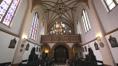 Smooth sliding movement inside St. Anne's Church featuring gothic architecture Stock Footage 334676454