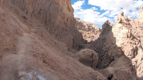 Smooth slow mo walking a rock terrain at Valle De La Luna desert Chile. Atacama Stock Footage 93848729