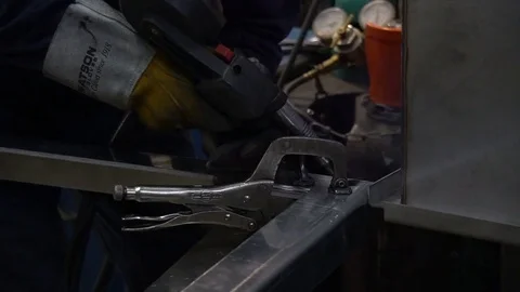 Smooth slow motion slider shot of industrial metal welding Stock Footage 75210870