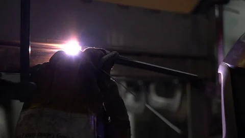 Smooth slow motion slider shot of industrial metal welding Stock Footage 75210937