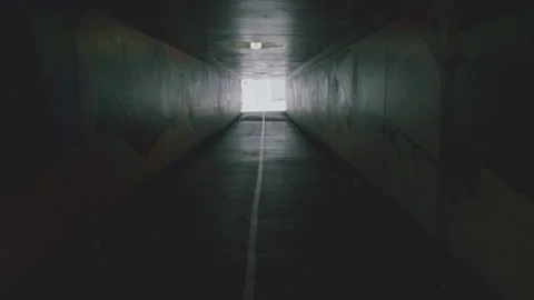 Smooth slowmotion walking through an Urban tunnel in Brisbane city  Stock Footage 268149038
