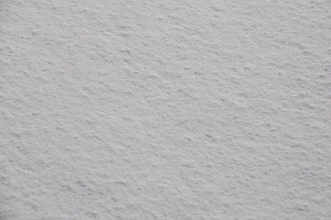 Smooth snow surface under the sun's rays. Stock Photos