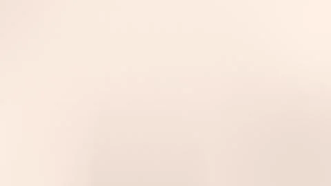 Smooth soft beige gradient background with subtle texture. Seamless loop, 4K. 動画素材 309058613