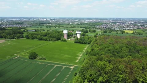 A smooth span overlooking two water towers, against a backdrop of green. Stock Footage 287094937