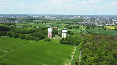 A smooth span overlooking two water towers, against a backdrop of green. Stock Footage 287094954