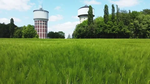 A smooth span overlooking two water towers, against a backdrop of green. Stock Footage 287094977