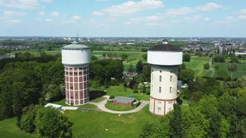 A smooth span overlooking two water towers, against a backdrop of green. Stock Footage 287094991