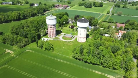 A smooth span overlooking two water towers, against a backdrop of green. Stock Footage 287095036