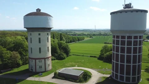 A smooth span overlooking two water towers, against a backdrop of green. Stock Footage 287095916