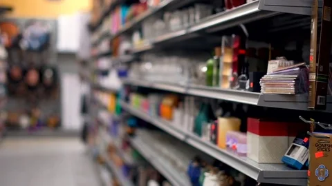 Smooth &amp; stabilized slow motion shot of dollar store aisle &amp; items for sale Video stock 78614320
