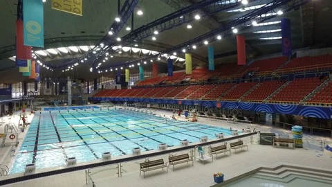 Smooth Steadicam Shot of Swimming Pool at The Olympic Stadium Stock Footage 75791007