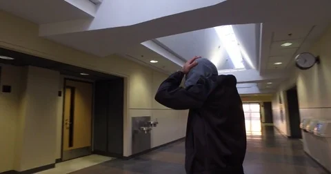 Smooth &amp; steady rapper flow in a empty university hallway Stock Footage 75791106