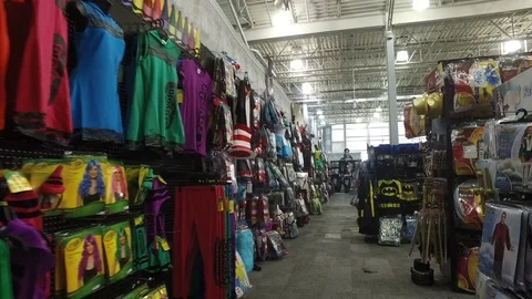 Smooth &amp; steady shot inside a Halloween costumes store Stock Footage 76151308