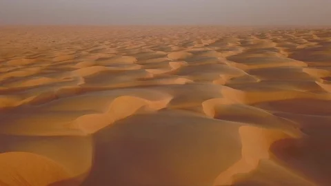 Smooth straight low altitude flight across beautifully layered sand dunes Stock Footage 90232629