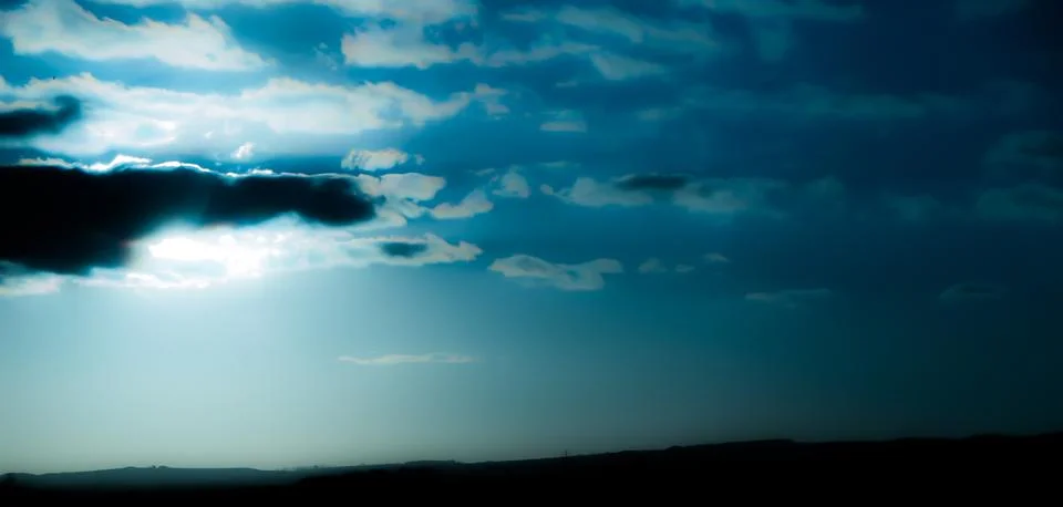 Smooth sun behind cloud Stock Photos