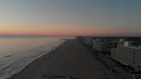 Smooth sunrise flight over a beach Stock Footage 87525343