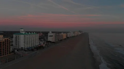 Smooth sunrise flight over a beach Stock Footage 87525786