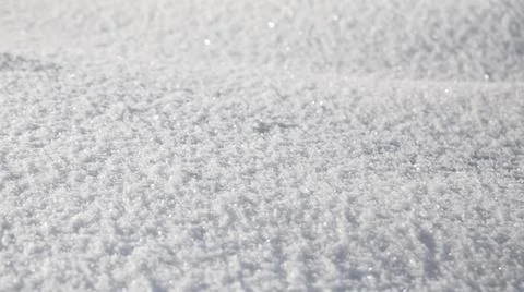 Smooth surface of clean fresh snow. Snowy ground. Winter background with snow Stock Photos