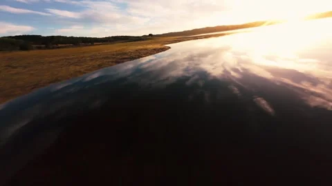 Smooth surface mirrors sky and sun at Alcacer do Sal Stock Footage 342184038