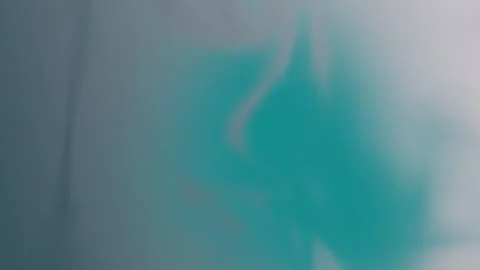 Smooth teal and gray gradient blend with soft fluid shapes, seamless loop Vídeo Stock 309856058