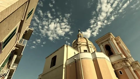 Smooth tilt shot moving backward past Chiesa Sant'Agostino in Giovinazzo Stock Footage 315992338