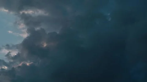 A smooth time lapse of a dramatic sunset, colorful surfing clouds, teal Stock Footage 271318673