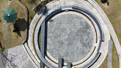 Smooth Top Down Aerial View of Circular Stone Plaza and Geometric Pattern Stock Footage 344778403
