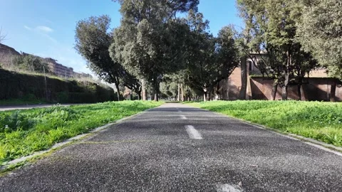 Smooth Tracking Shot Of Bicycle Path In Central Rome Along River 動画素材 330123238
