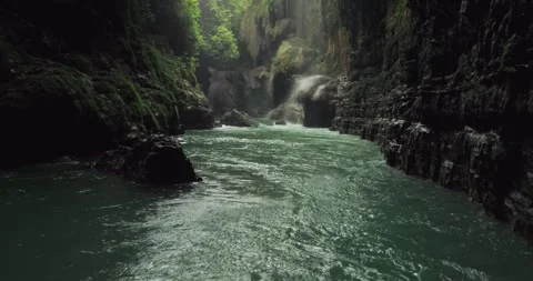 Smooth Tropical River Flow Through Canyon with Clear Water Aerial Stock Footage 332653418