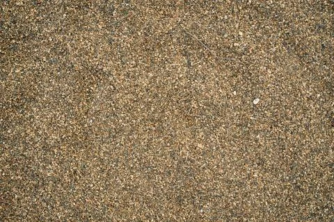 Smooth uniform layer of bulk river sediment sand and aggregate, providing a.. Stock Photos