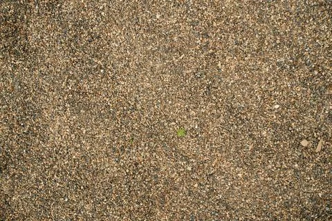 Smooth uniform layer of bulk river sediment sand and aggregate, providing an  Stock Photos