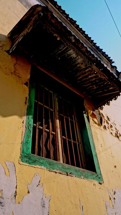Smooth upward vertical tilt camera movement revealing an old vintage window.. Stock Footage 342034958