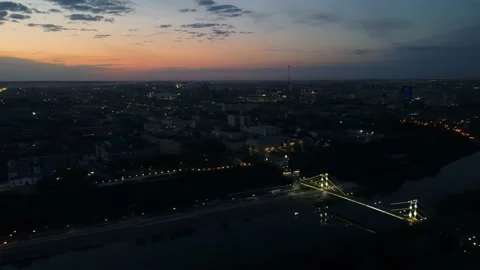 Smooth video from a copter, evening sunset over the city Orenburg embankment Vidéo 205517849