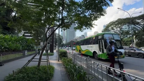 Smooth walking POV shot of a modern street and skyline in Makati 4K Vídeos de archivo 337950377