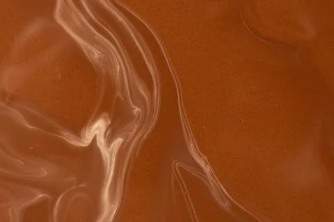 Smooth warm chocolate wave pattern, macro photography Stock Photos