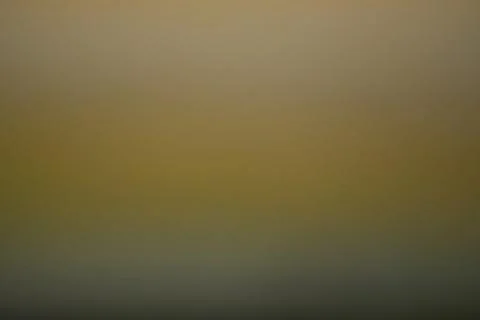 Smooth Warm Gradient Bokeh Background with Golden and Soft Blue Tones Foto stock