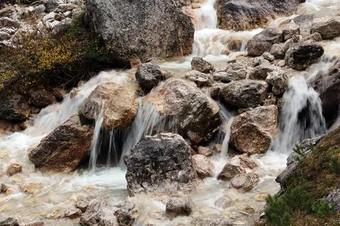 Smooth water flow is going down from rocks Stock Photos