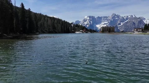 Smooth Water Level Drone Drift Forward Discovering Remote Alpine Village Stock Footage 340758286
