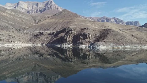 Smooth water mirror rocks high in the mountains Stock-Footage 83726868
