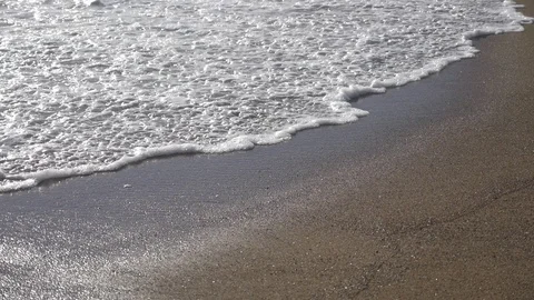 Smooth wave over the beach sand Stock Footage 124259411