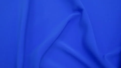 Smooth waves of blue cloth rippling in the wind. Background Fabric is turquoi Stock Footage 169529598