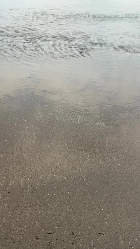 Smooth waves on a calm beach Stock Footage 287824771
