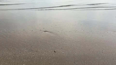 Smooth waves on a calm beach 스톡 동영상 287825213