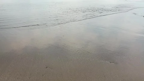 Smooth waves on a calm beach Stock Footage 287825252