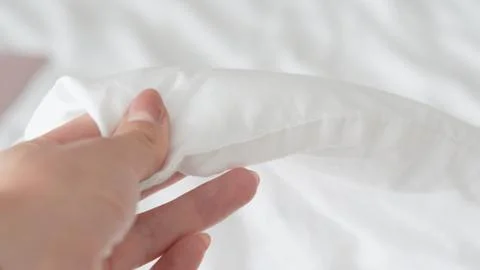 Smooth white bedsheet background, soft texture, clean and minimalist style. Stock Photos